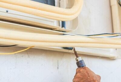 depositphotos_108068138-stock-photo-technician-install-air-conditioner